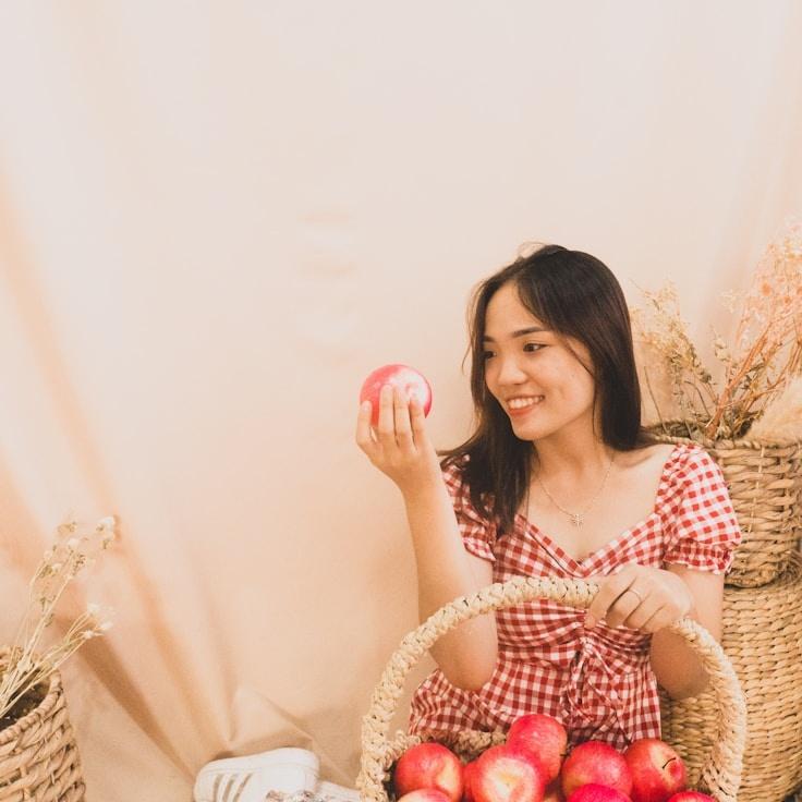 Kaveri Mehta, Lead Design Curator at ExpanseMeadowCompass, reviewing corporate floral arrangements